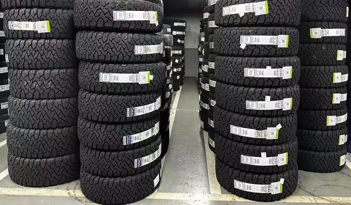 Stacks of new all-terrain tires in a Peter-owned supply setting
