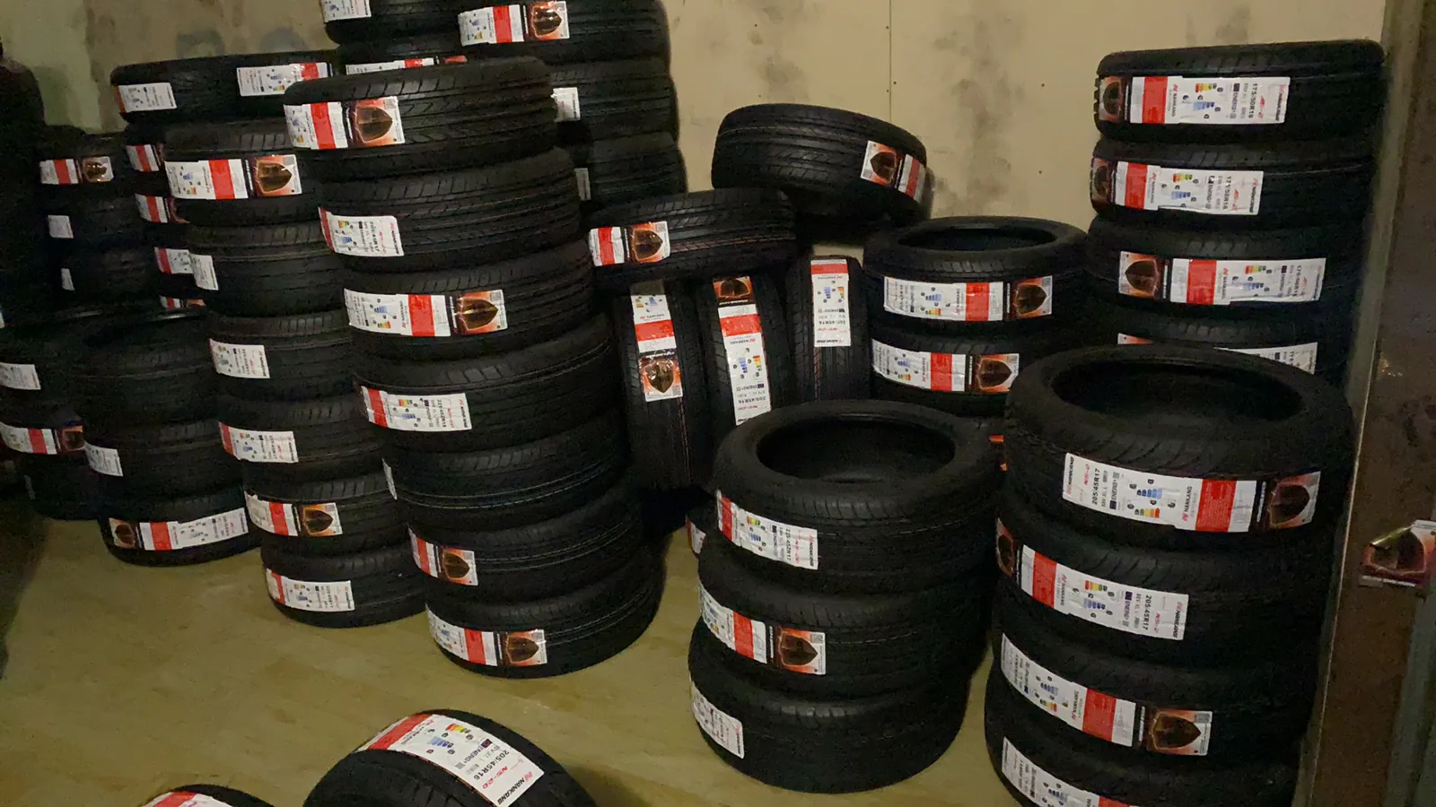 Labelled new tires arranged at Peter's operating site